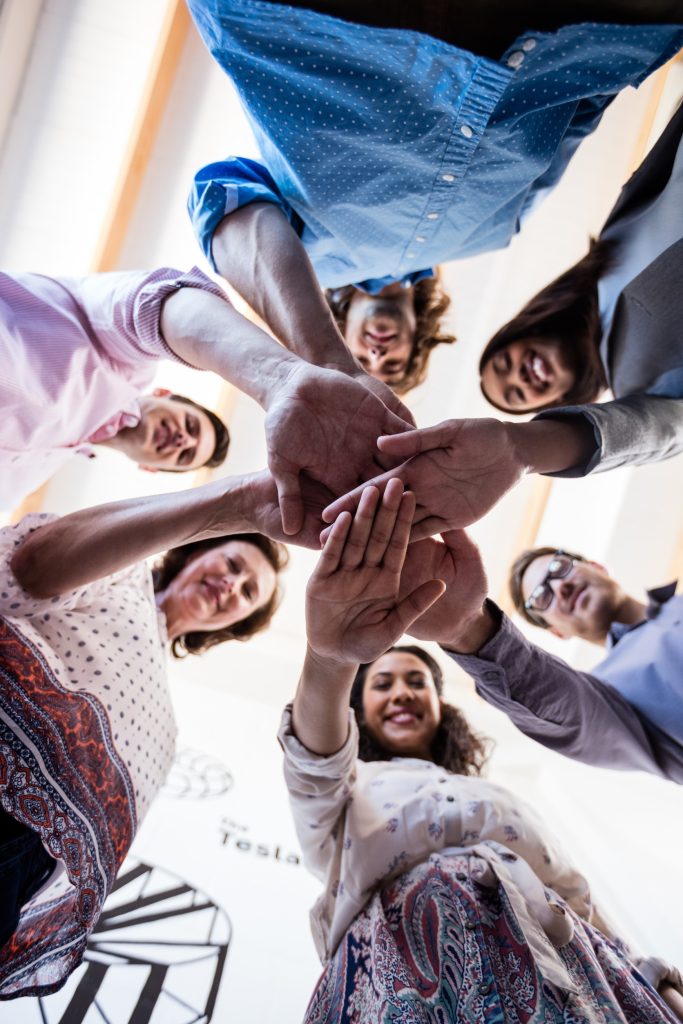 Image of happy team members after a successful Improving Communications course.
